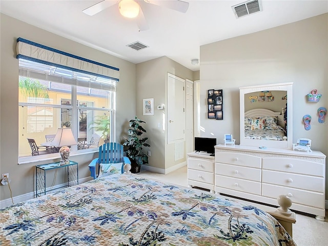 bedroom featuring ceiling fan and light carpet