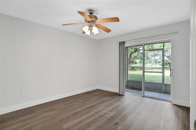 unfurnished room with dark hardwood / wood-style floors and ceiling fan