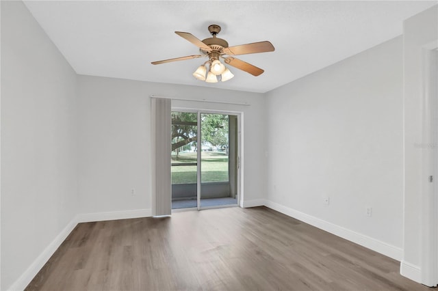 unfurnished room with hardwood / wood-style floors and ceiling fan