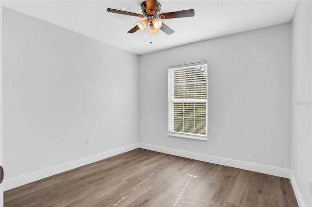 spare room featuring ceiling fan and wood-type flooring