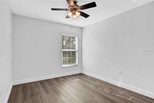 spare room featuring ceiling fan and hardwood / wood-style floors