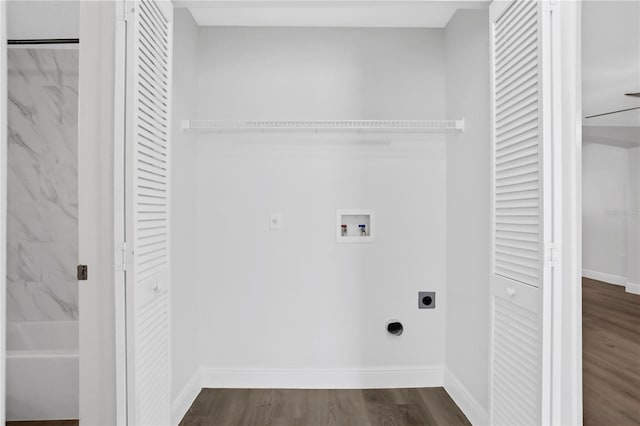 laundry room featuring electric dryer hookup, hookup for a washing machine, and dark wood-type flooring