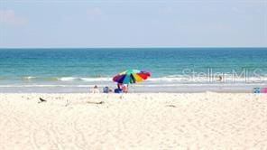 view of water feature with a beach view