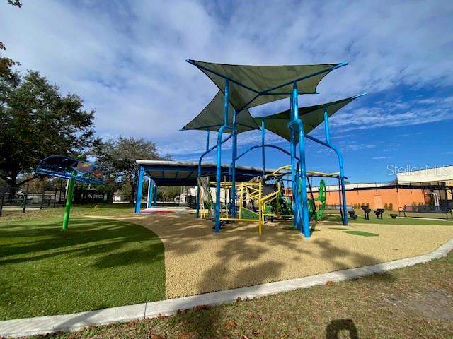 community playground with a lawn