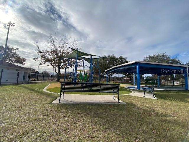 surrounding community featuring a gazebo, playground community, and a yard