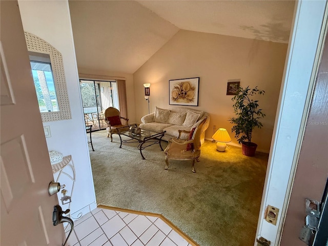 carpeted living room with lofted ceiling