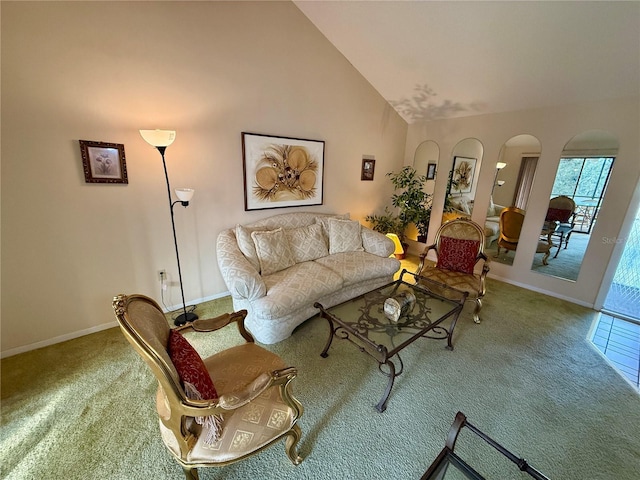 living room with carpet floors and high vaulted ceiling