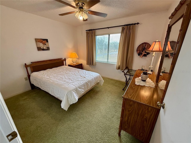 bedroom featuring ceiling fan, carpet floors, and a textured ceiling