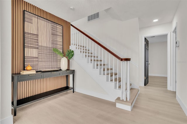 stairway featuring hardwood / wood-style flooring