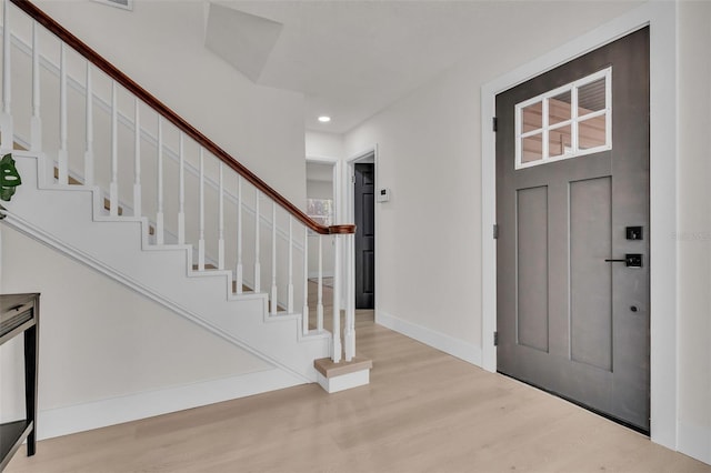 foyer entrance with light hardwood / wood-style flooring