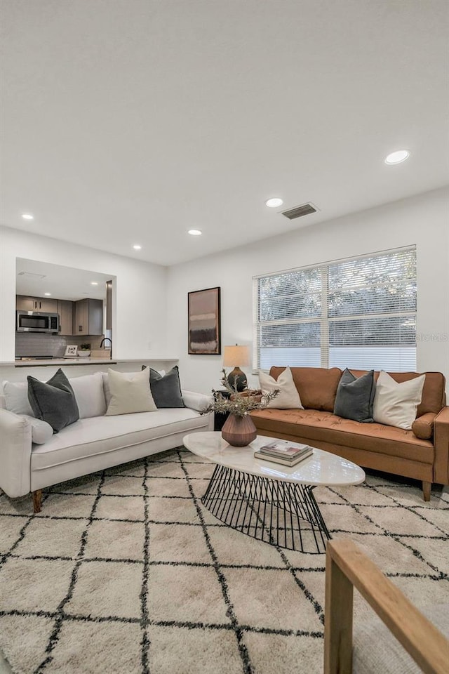 living room featuring a wealth of natural light