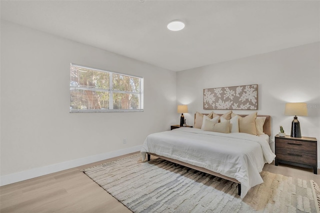 bedroom with light hardwood / wood-style flooring