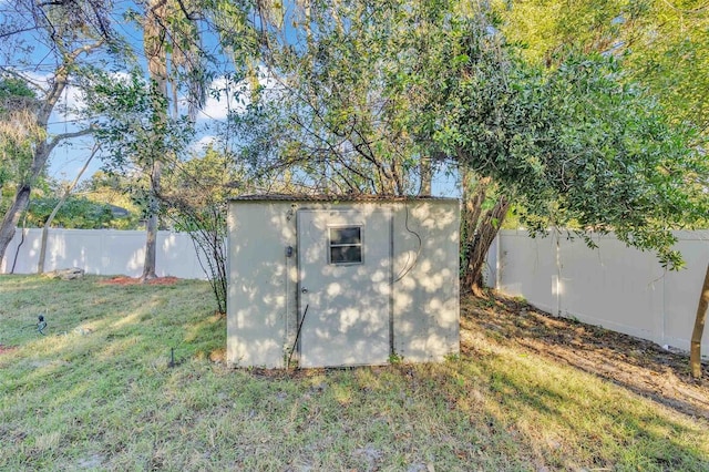 view of outbuilding with a lawn