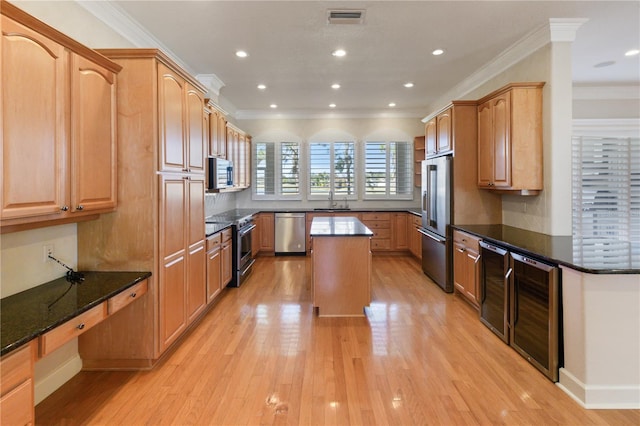 kitchen featuring decorative backsplash, appliances with stainless steel finishes, ornamental molding, beverage cooler, and a center island