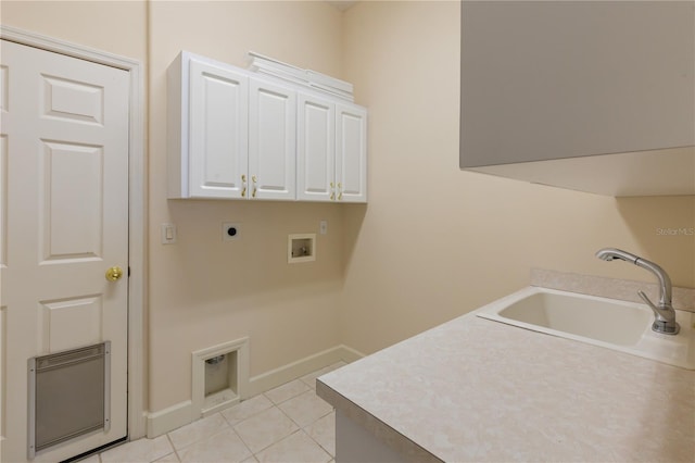 clothes washing area featuring cabinets, washer hookup, electric dryer hookup, sink, and light tile patterned floors