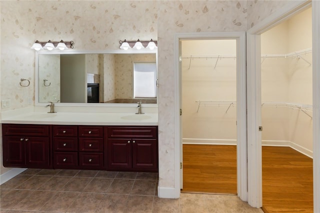 bathroom with tile patterned flooring and vanity