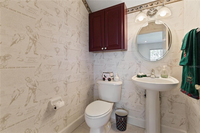 bathroom with tile patterned flooring and toilet