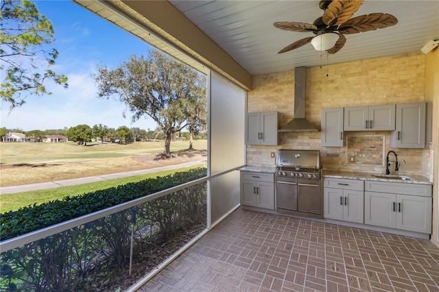 exterior space featuring ceiling fan and sink