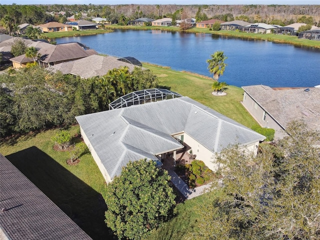 birds eye view of property featuring a water view