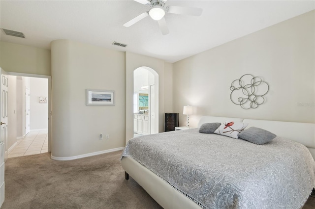 bedroom featuring ceiling fan and light carpet