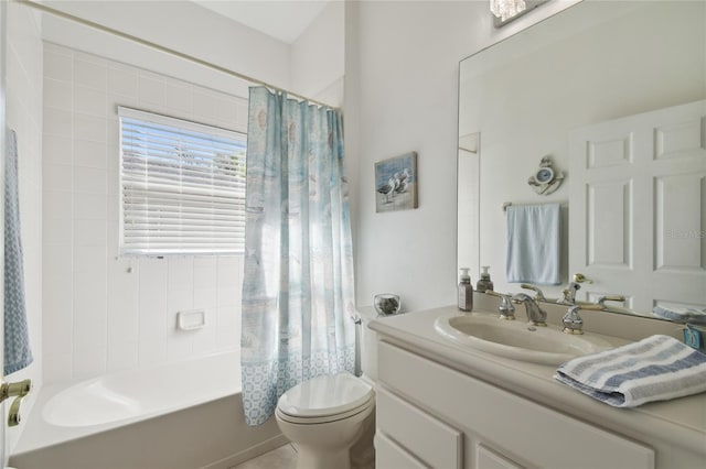 full bathroom with shower / bath combination with curtain, vanity, and toilet