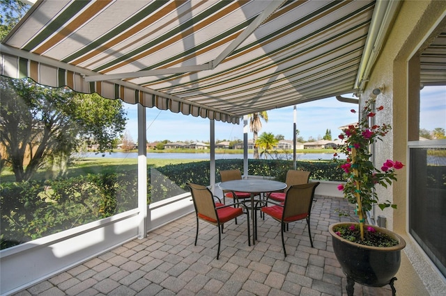 sunroom with a water view