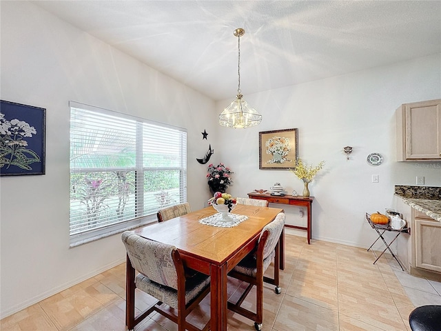 dining area featuring light tile patterned floors and a chandelier