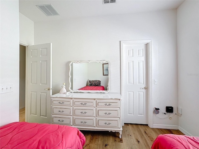 bedroom with light hardwood / wood-style flooring