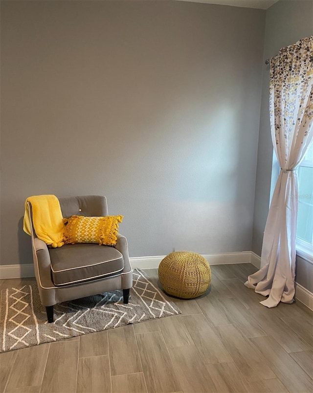 sitting room featuring hardwood / wood-style floors