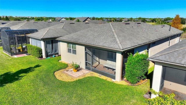 back of house with a lanai and a lawn