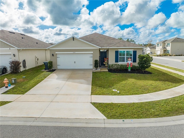 ranch-style home with a front lawn and a garage