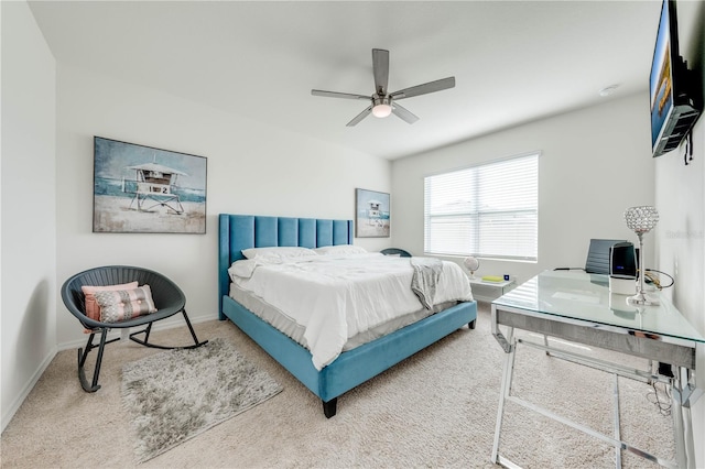 bedroom with ceiling fan and carpet floors