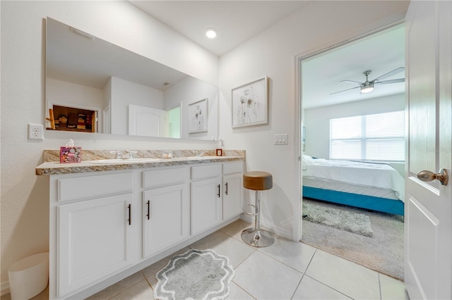 bathroom featuring tile patterned flooring, vanity, and ceiling fan