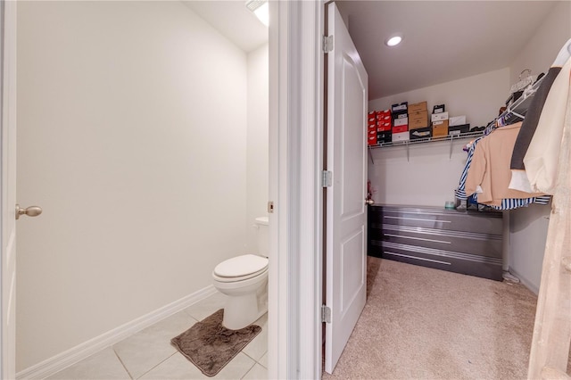 bathroom featuring tile patterned floors and toilet