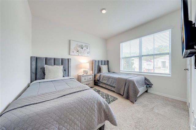 bedroom with light carpet