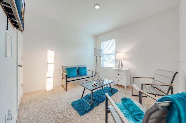 living area featuring light colored carpet