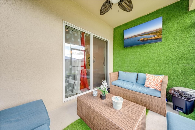 balcony with ceiling fan and an outdoor living space