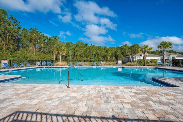 view of swimming pool with a patio area