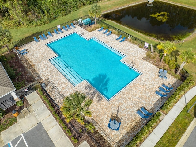 view of pool with a water view