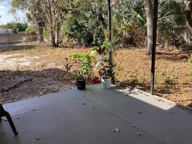 view of patio / terrace featuring fence