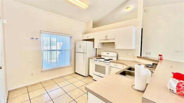 kitchen featuring light tile patterned floors, light countertops, white cabinets, vaulted ceiling, and white appliances