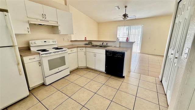 kitchen with white appliances, under cabinet range hood, white cabinets, and a sink