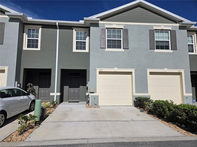 multi unit property featuring a garage