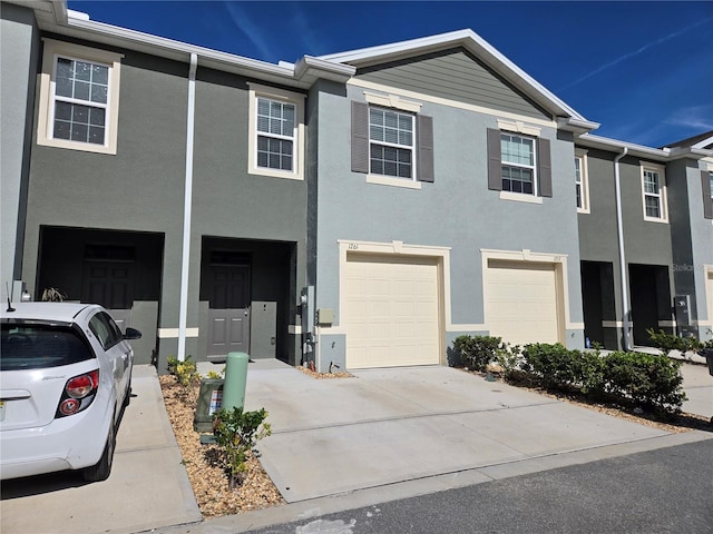 multi unit property featuring a garage