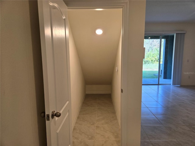 hall with light tile patterned flooring