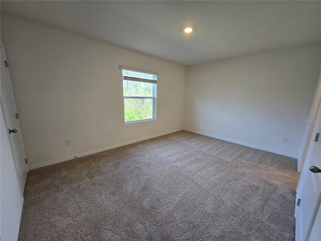 unfurnished room featuring carpet floors