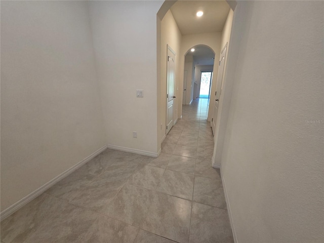 hallway featuring light tile patterned flooring