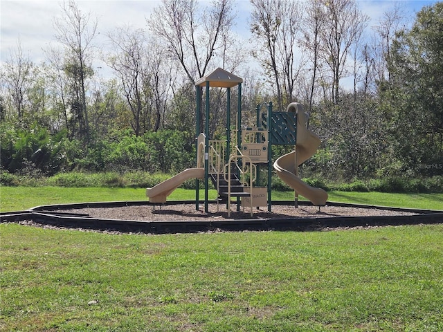 view of jungle gym featuring a lawn