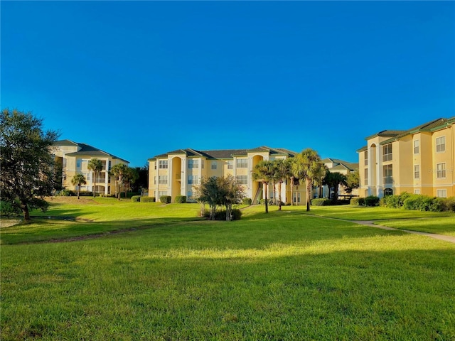 view of home's community featuring a lawn