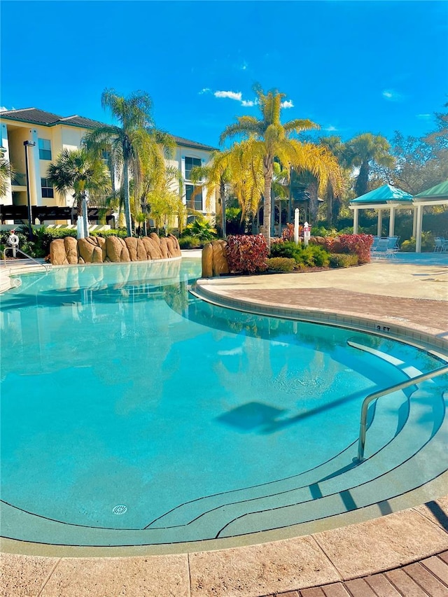 view of pool featuring a gazebo and a patio area